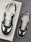 Кеды бело-чёрные от Alexander McQueen Oversized Retro Sneaker BP5-034389 — фото 5 [TG 0a09e2bb24e1-005]