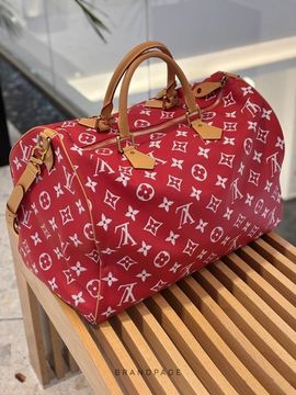 Дорожная сумка красная с белым узором и светло-коричневой отделкой от Louis Vuitton Speedy P9 Bandoulière 50 BP5-146611